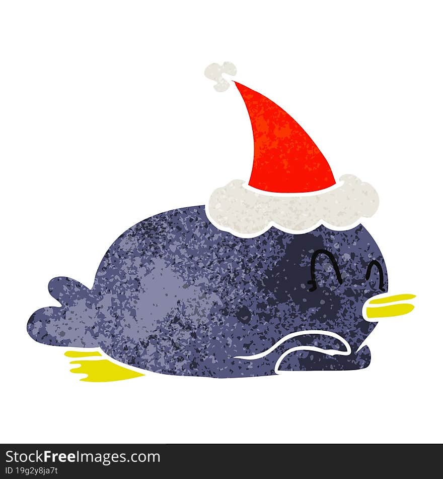 penguin lying on belly wearing santa hat