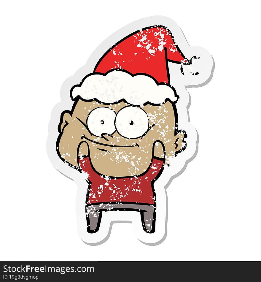 distressed sticker cartoon of a bald man staring wearing santa hat