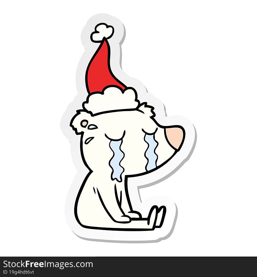 sticker cartoon of a crying sitting polar bear wearing santa hat