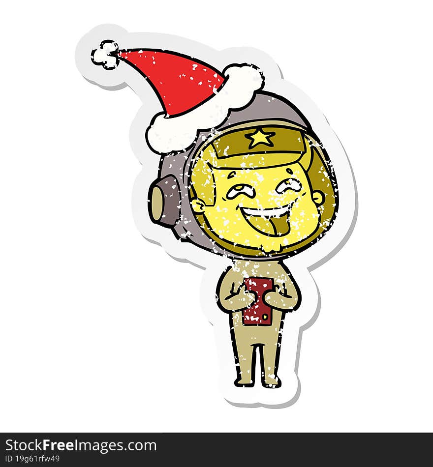 Distressed Sticker Cartoon Of A Laughing Astronaut Wearing Santa Hat