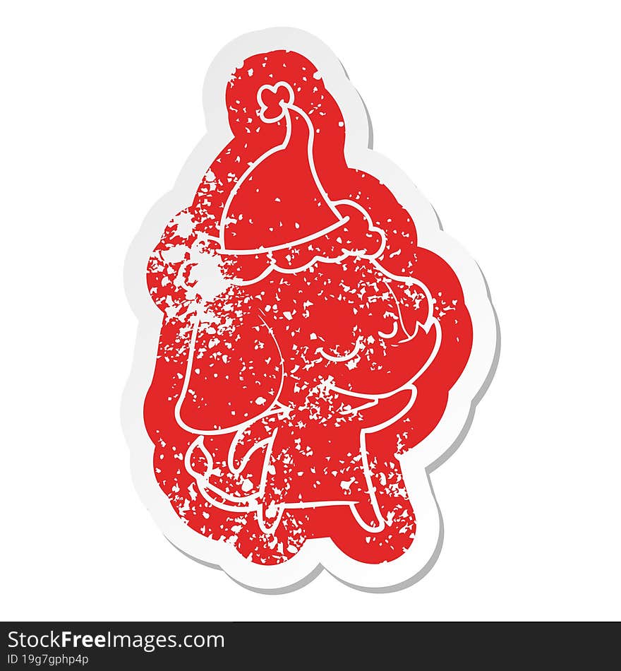 cartoon distressed sticker of a smiling elephant wearing santa hat