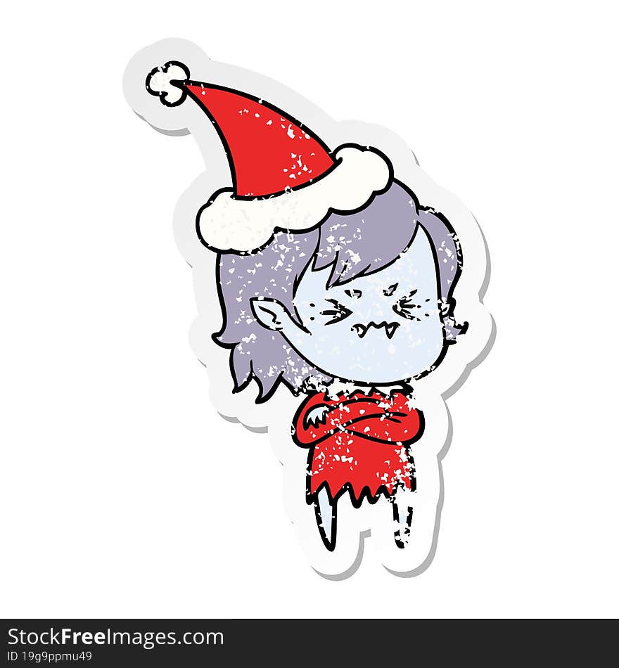 annoyed distressed sticker cartoon of a vampire girl wearing santa hat