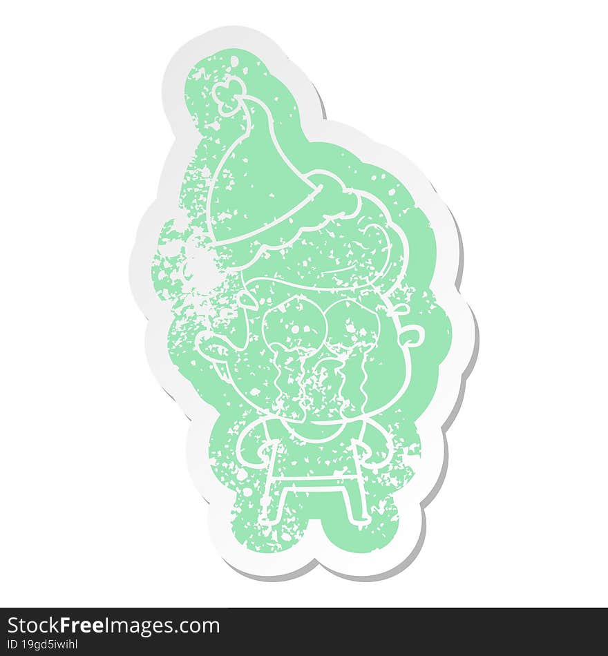 Cartoon Distressed Sticker Of A Crying Man Wearing Santa Hat