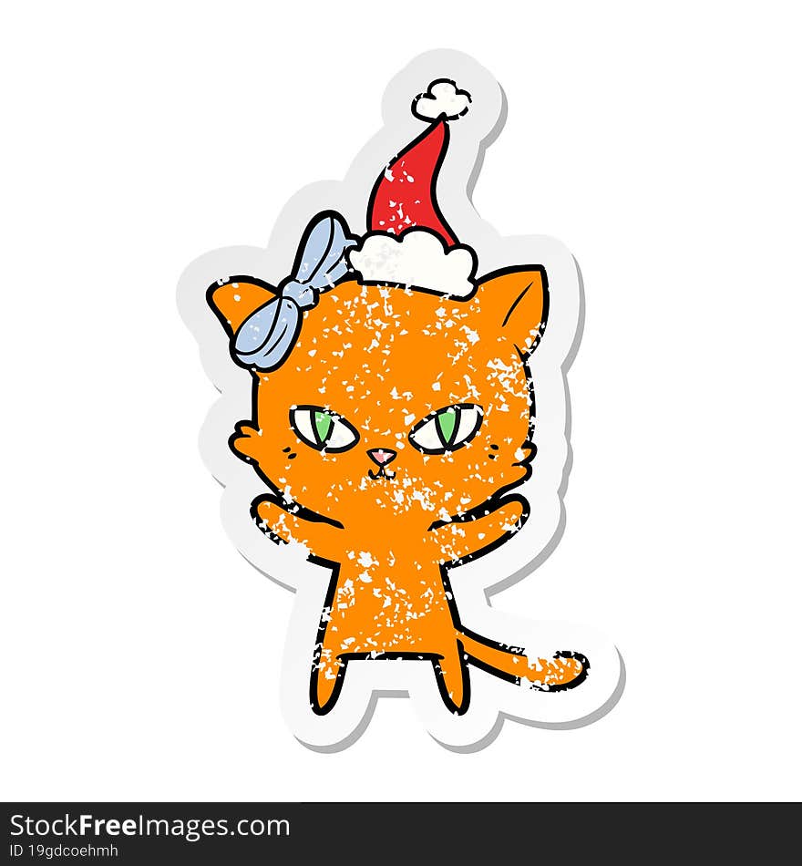 cute distressed sticker cartoon of a cat wearing santa hat