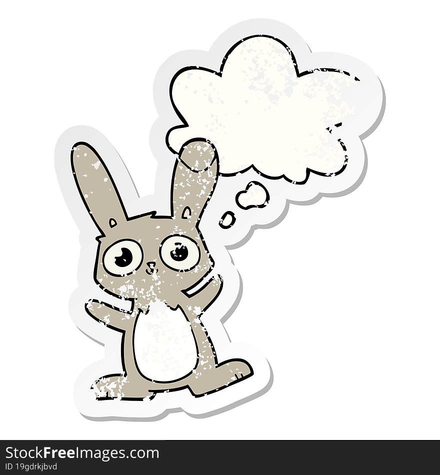 cute cartoon rabbit with thought bubble as a distressed worn sticker