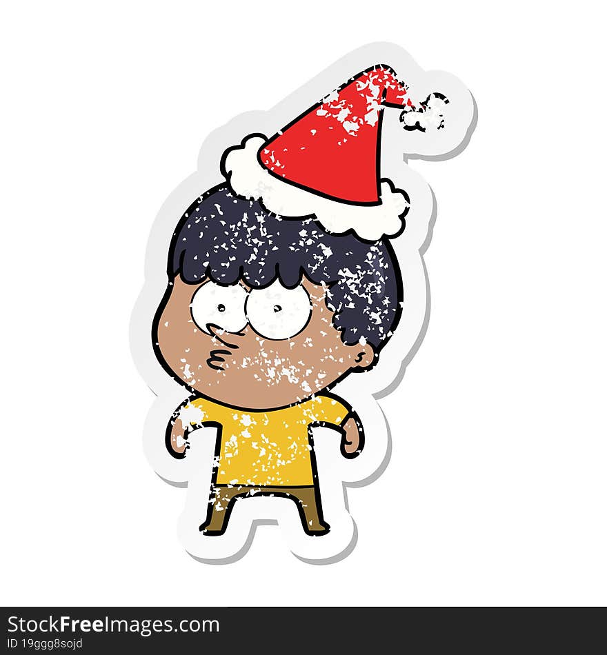 distressed sticker cartoon of a curious boy wearing santa hat