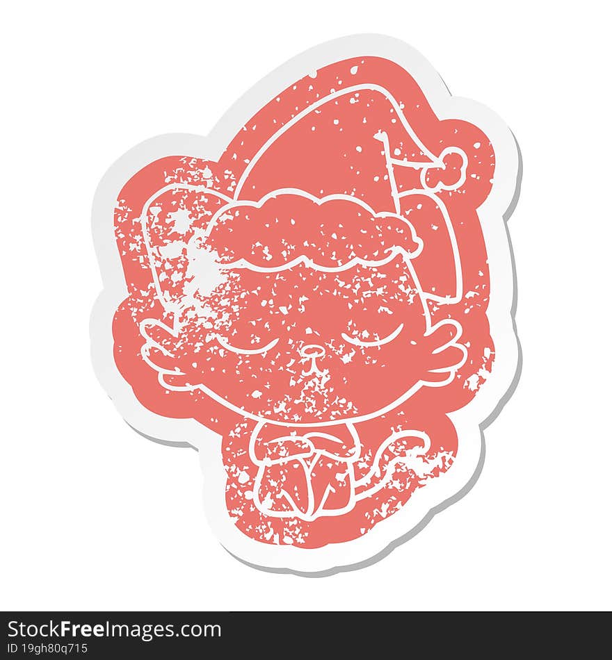 cute cartoon distressed sticker of a dog wearing santa hat