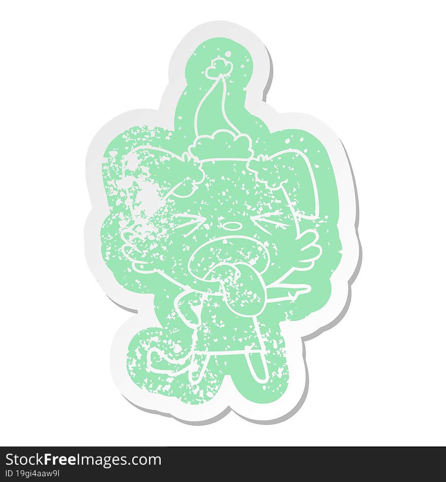 quirky cartoon distressed sticker of a disgusted dog wearing santa hat