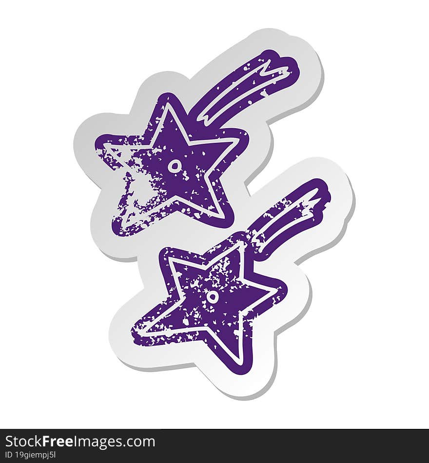 distressed old sticker of ninja throwing stars