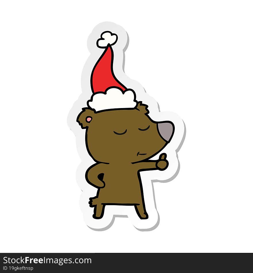 happy sticker cartoon of a bear giving thumbs up wearing santa hat