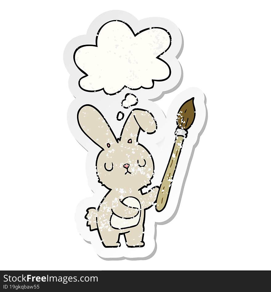 cartoon rabbit with paint brush with thought bubble as a distressed worn sticker