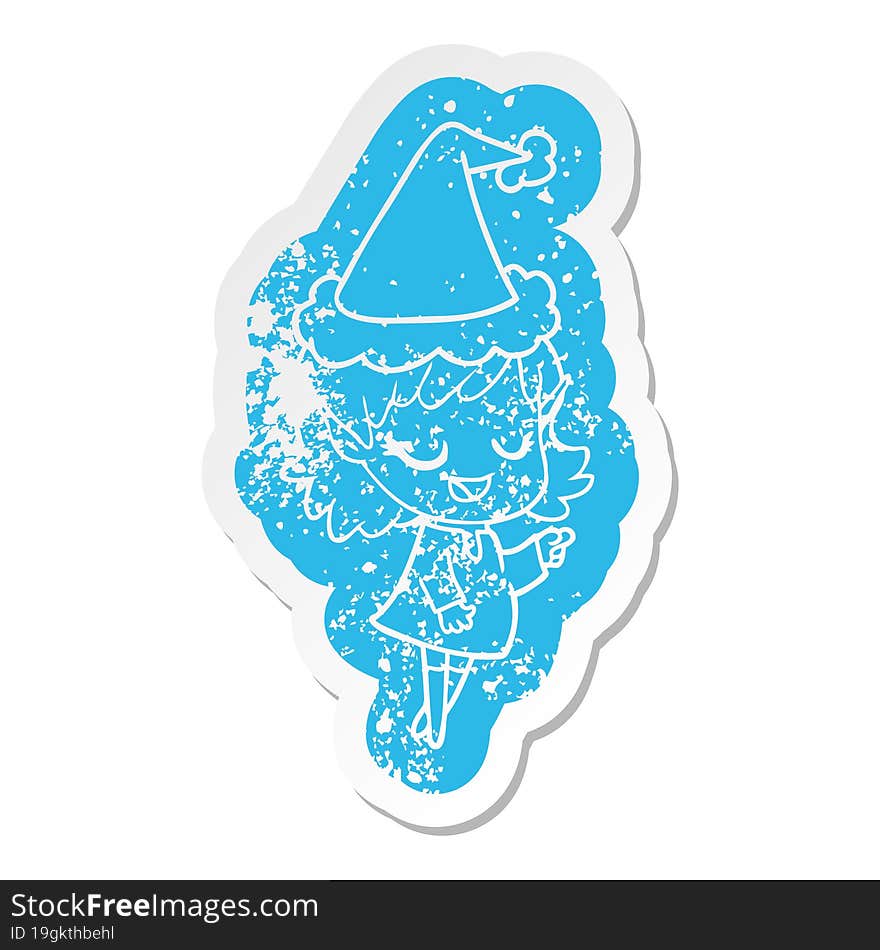 happy cartoon distressed sticker of a elf girl pointing wearing santa hat