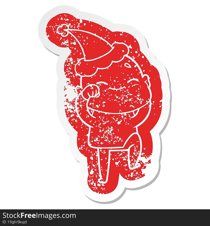 happy cartoon distressed sticker of a bald man wearing santa hat