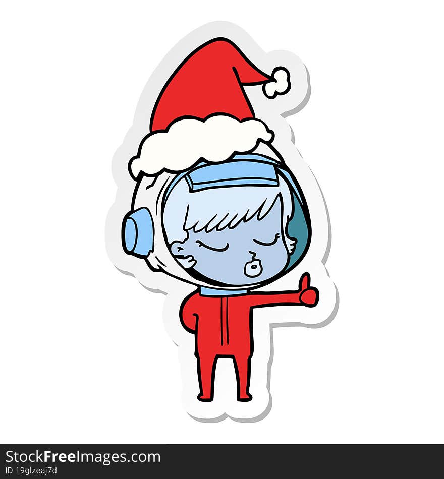 sticker cartoon of a pretty astronaut girl giving thumbs up wearing santa hat