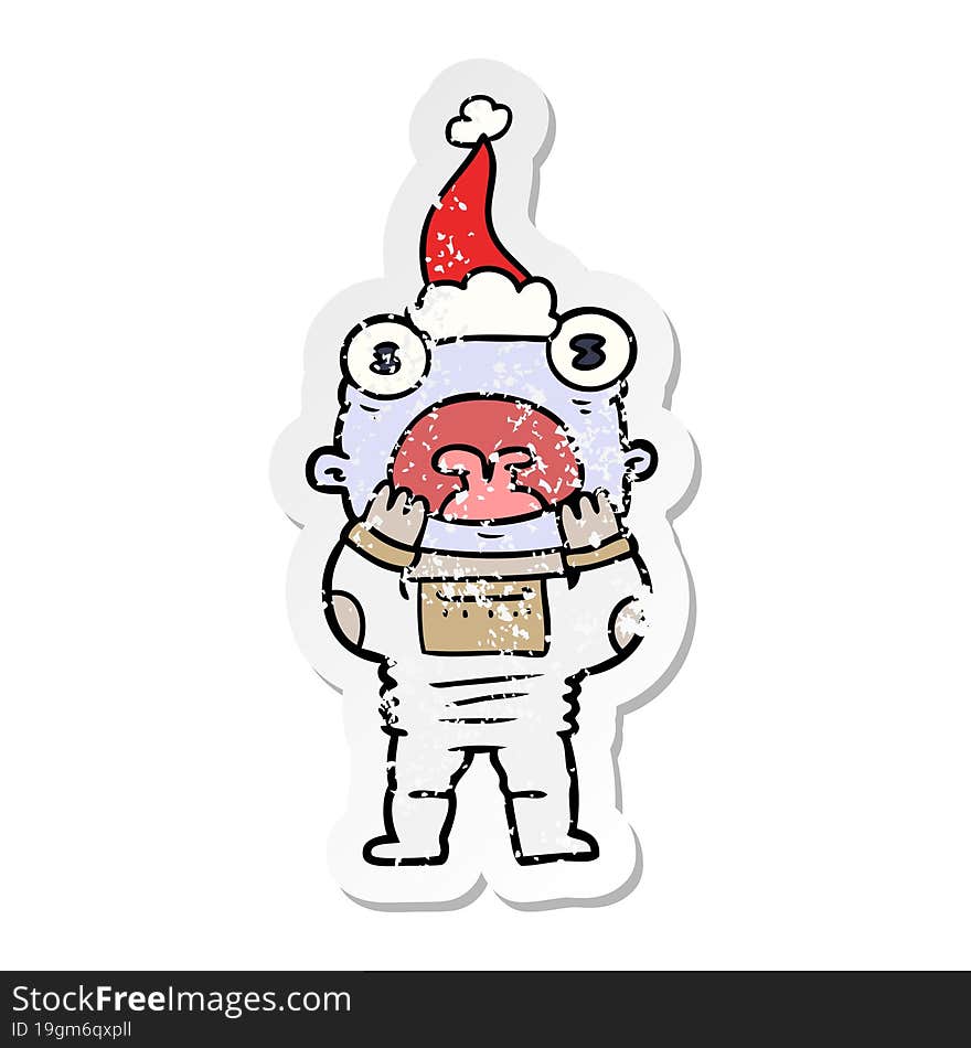 distressed sticker cartoon of a alien gasping in surprise wearing santa hat