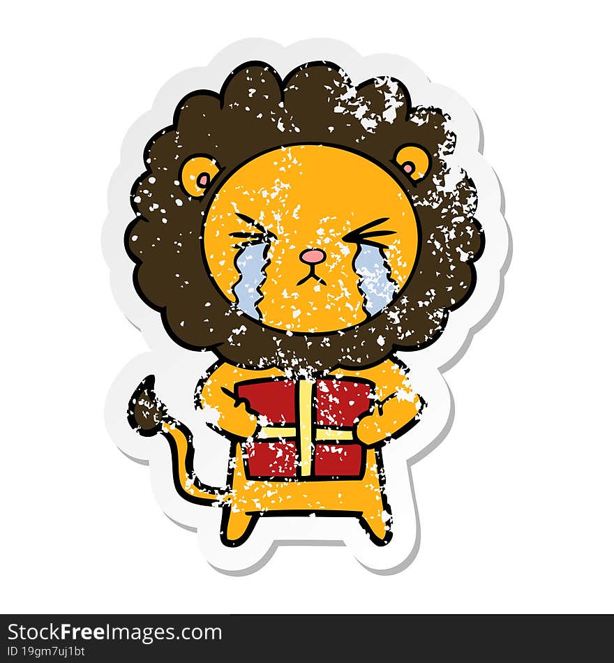 distressed sticker of a cartoon crying lion with gift