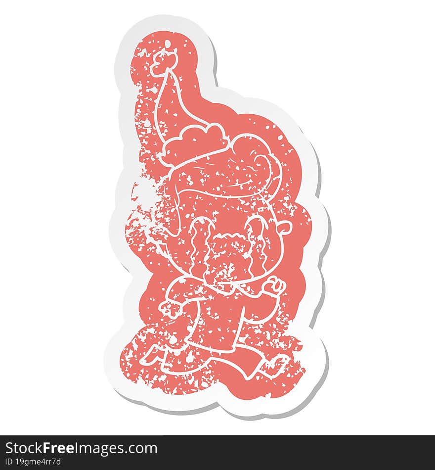 cartoon distressed sticker of a man crying wearing santa hat