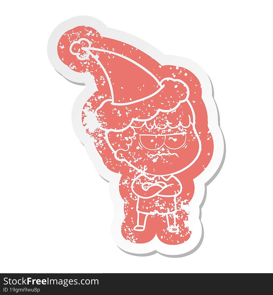 cartoon distressed sticker of an annoyed man wearing santa hat