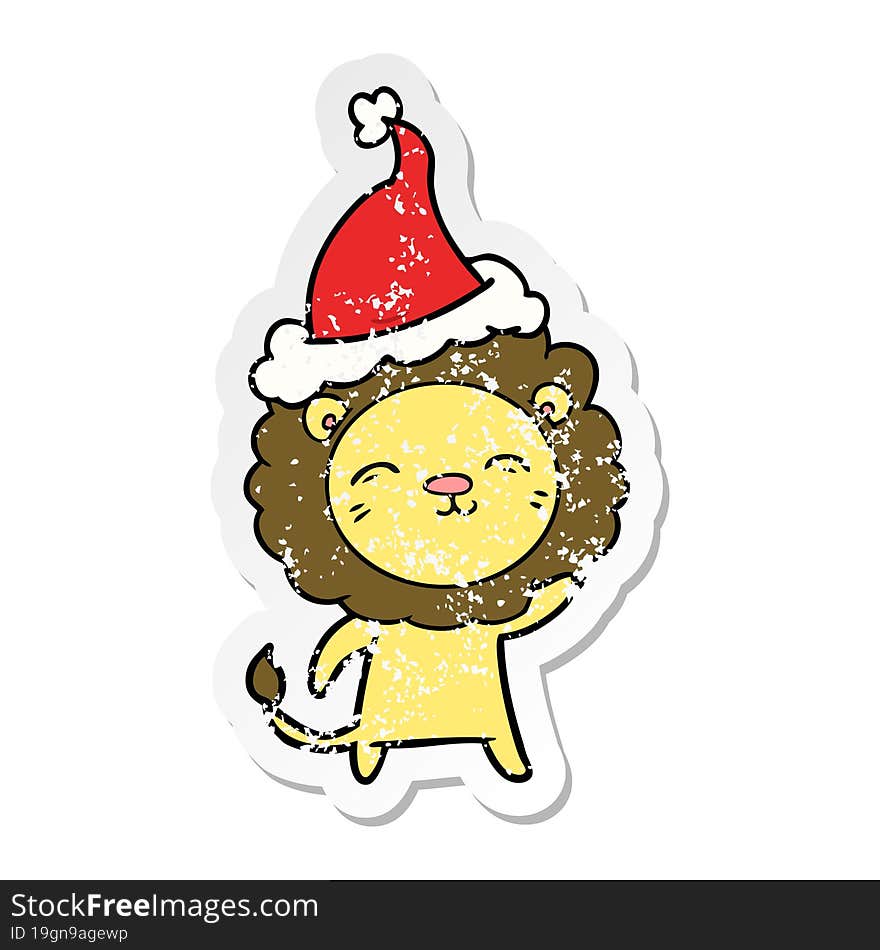 distressed sticker cartoon of a lion wearing santa hat