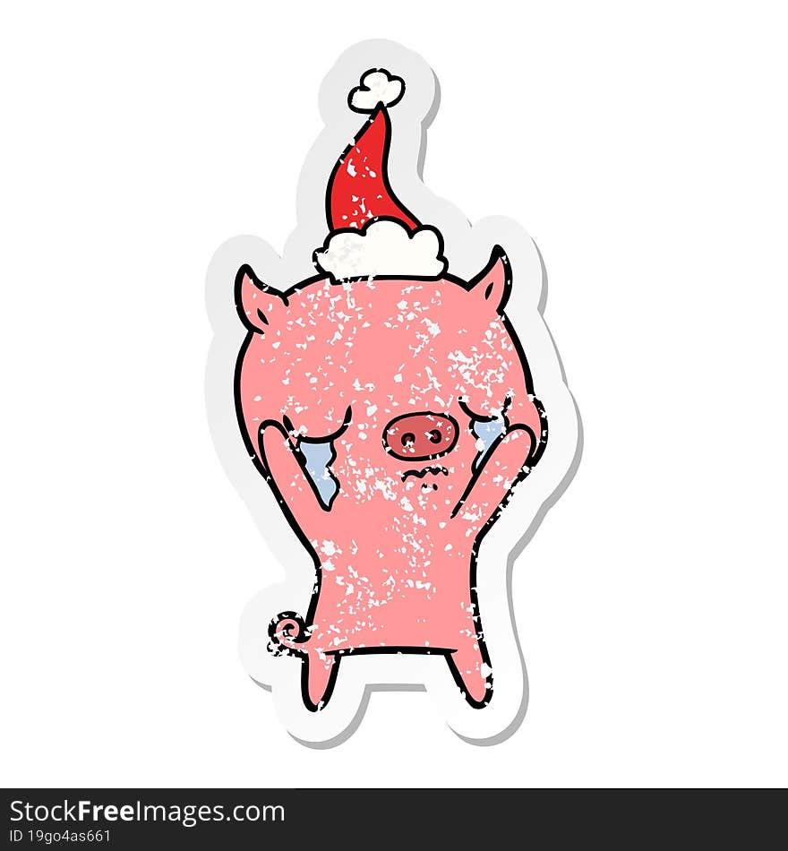 distressed sticker cartoon of a pig crying wearing santa hat