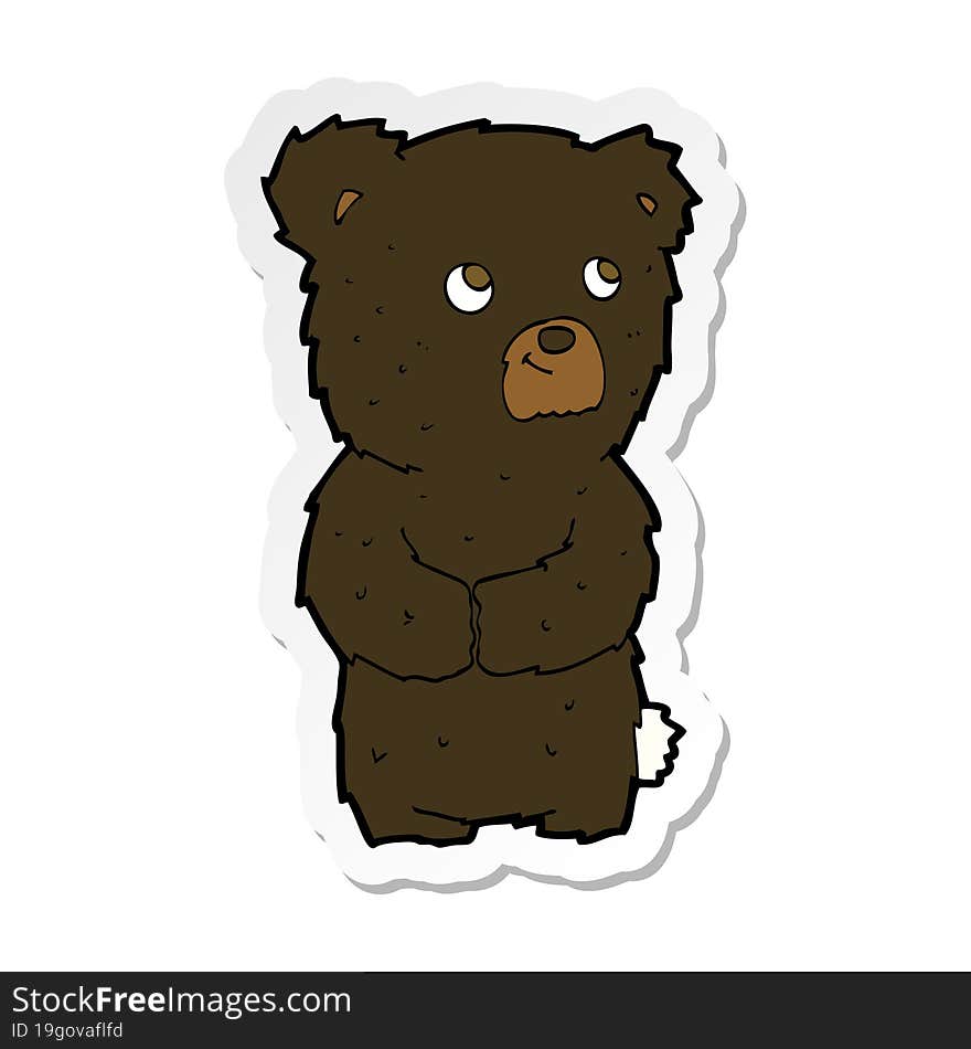 sticker of a cartoon black bear cub