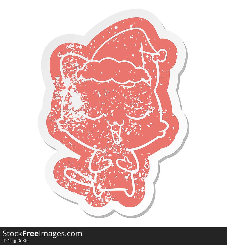 happy cartoon distressed sticker of a cat wearing santa hat