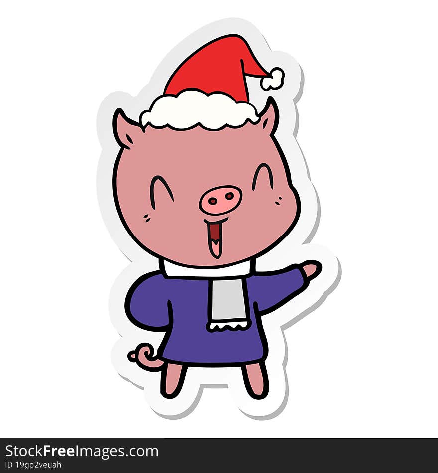 happy sticker cartoon of a pig in winter clothes wearing santa hat