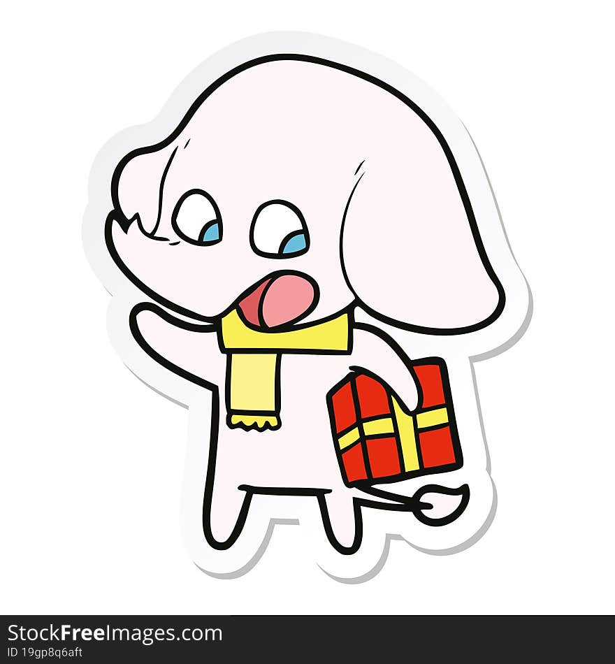 sticker of a cute cartoon elephant with christmas present