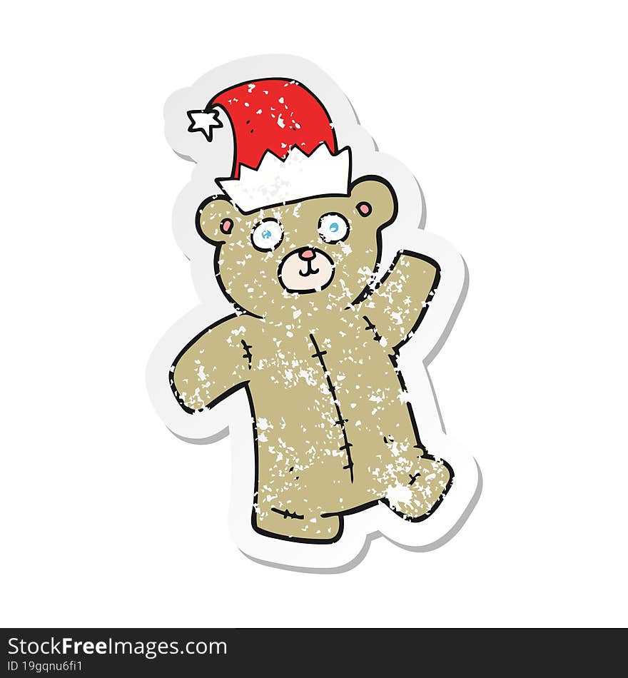 retro distressed sticker of a cartoon teddy bear wearing christmas hat