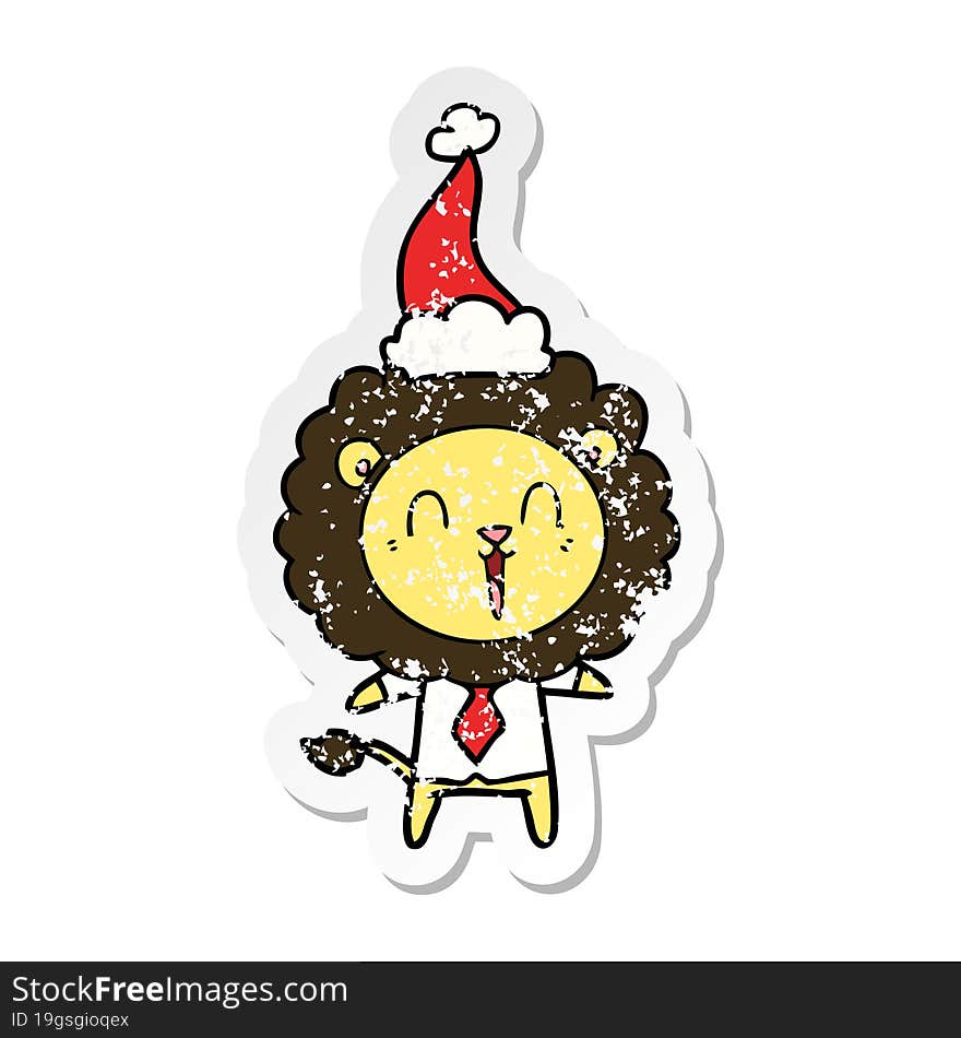 laughing lion distressed sticker cartoon of a wearing santa hat