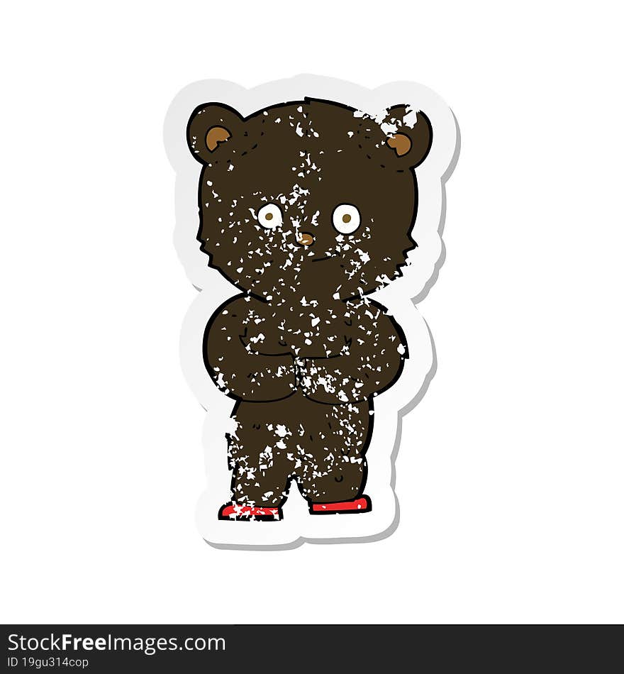 retro distressed sticker of a cartoon teddy black bear cub