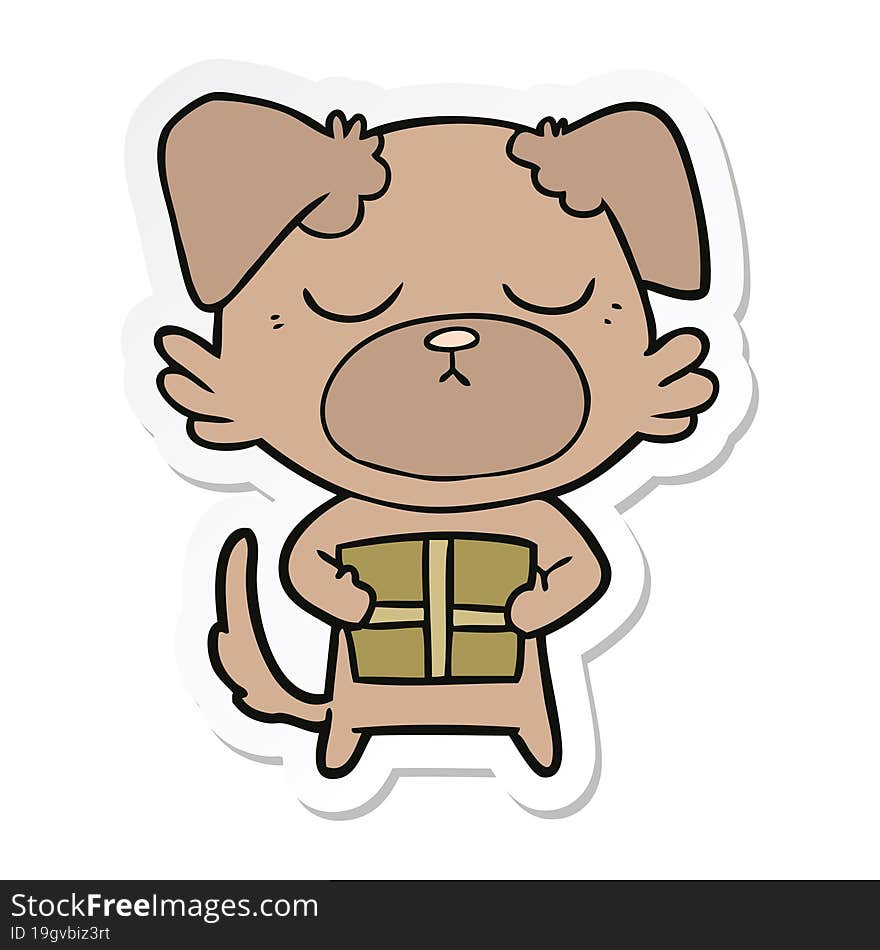 sticker of a cute cartoon dog with christmas present