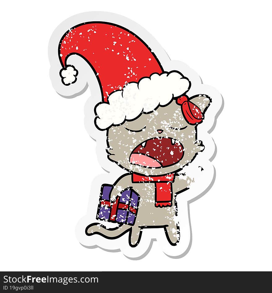 distressed sticker of a cartoon cat with christmas present