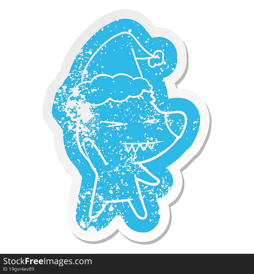 angry polar bear cartoon distressed sticker of a wearing santa hat