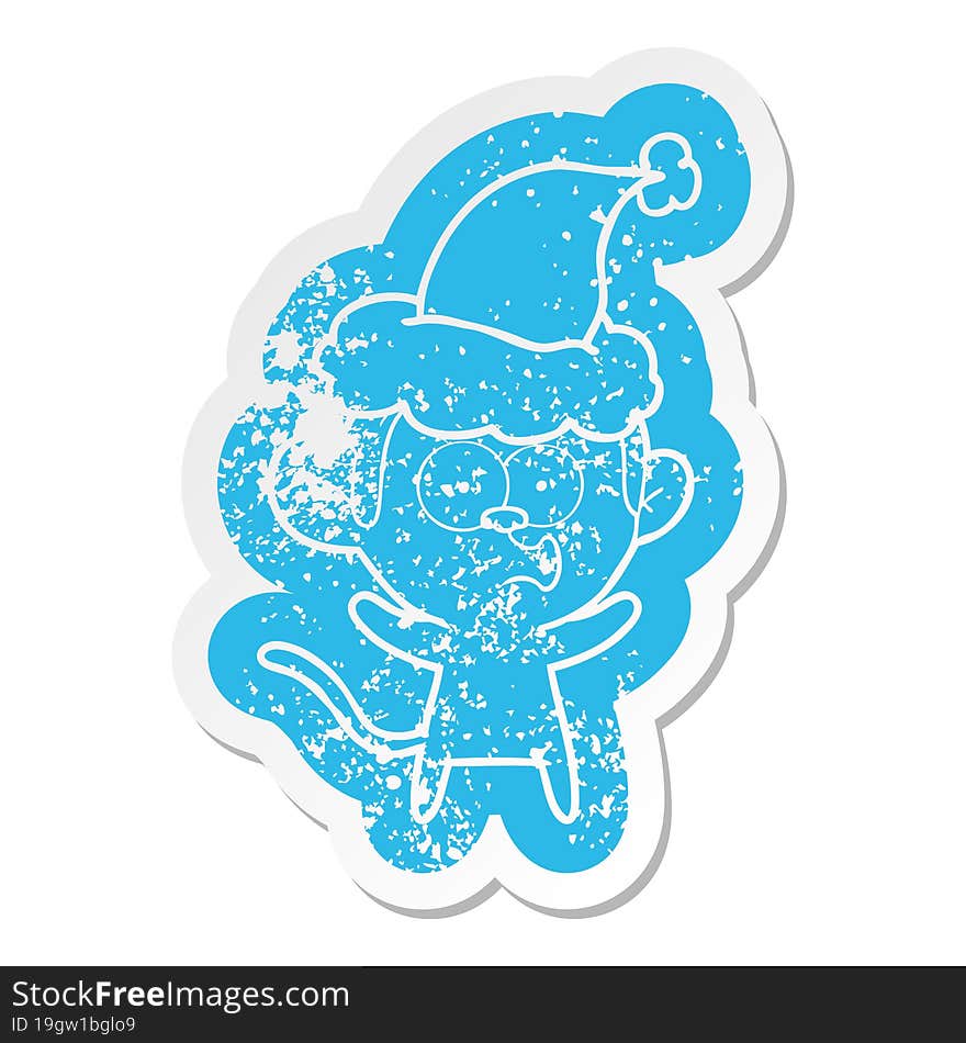 cartoon distressed sticker of a surprised monkey wearing santa hat