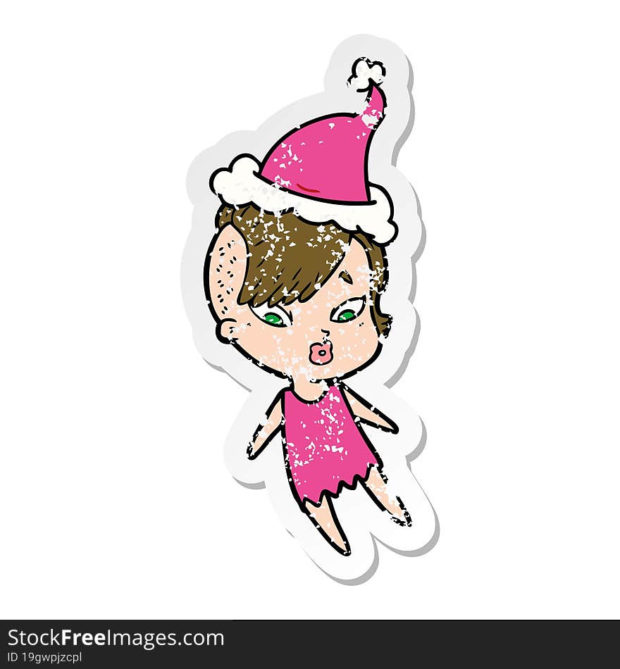 distressed sticker cartoon of a surprised girl wearing santa hat