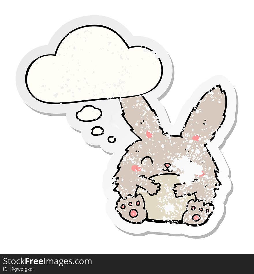 cute cartoon rabbit and thought bubble as a distressed worn sticker