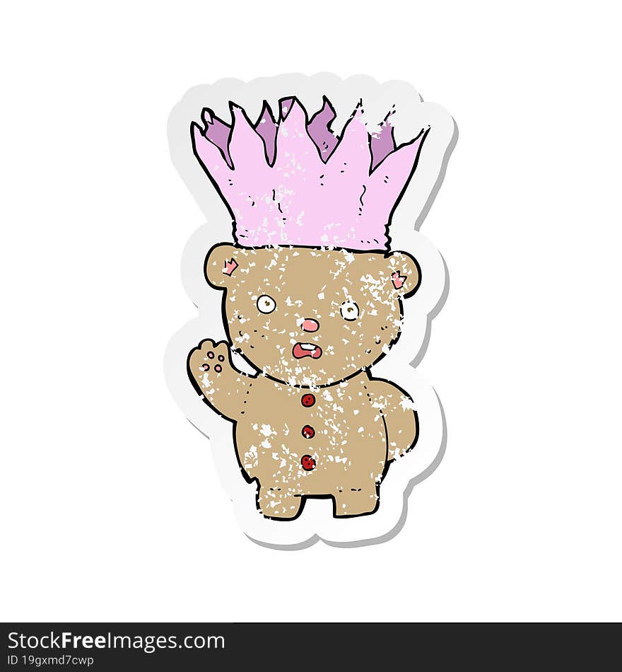 Retro Distressed Sticker Of A Cartoon Teddy Bear Wearing Paper Crown