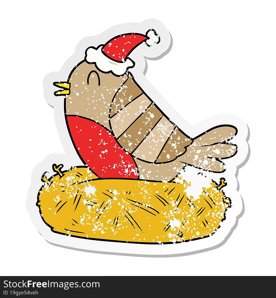 hand drawn distressed sticker cartoon of a bird sitting on nest wearing santa hat