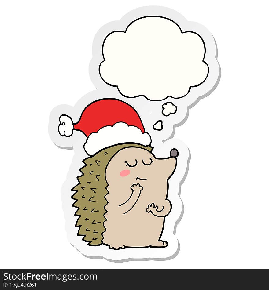 cartoon hedgehog wearing christmas hat and thought bubble as a printed sticker