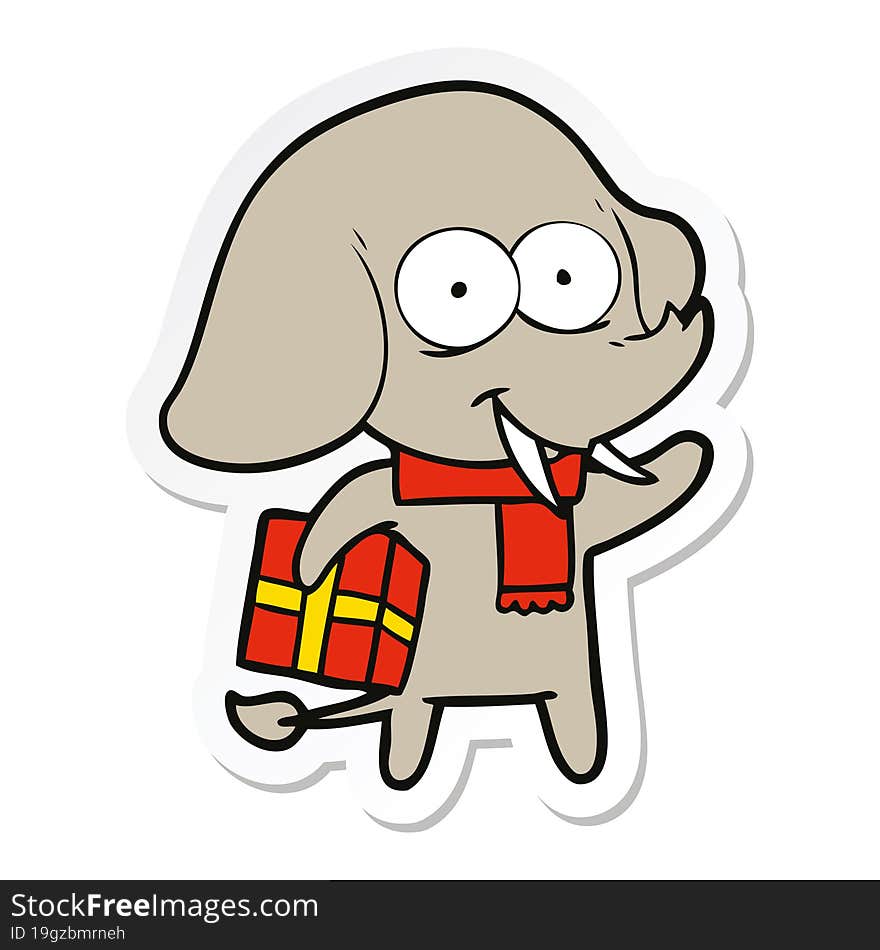 sticker of a happy cartoon elephant with present