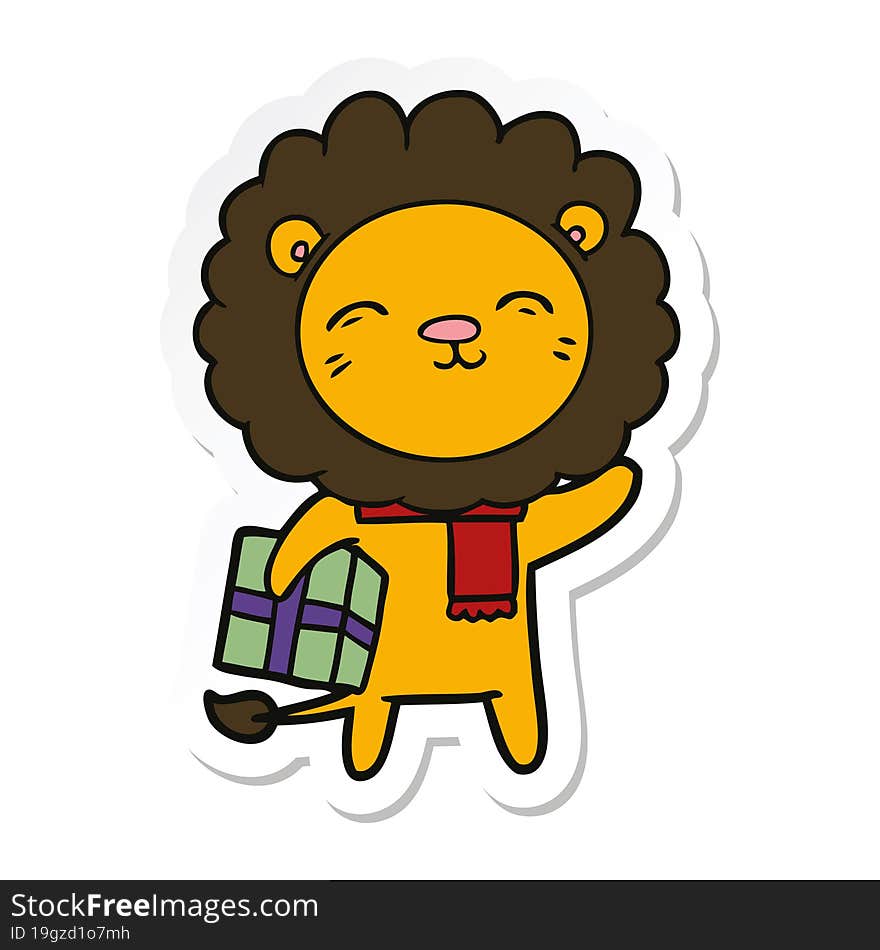 sticker of a cartoon lion with christmas present