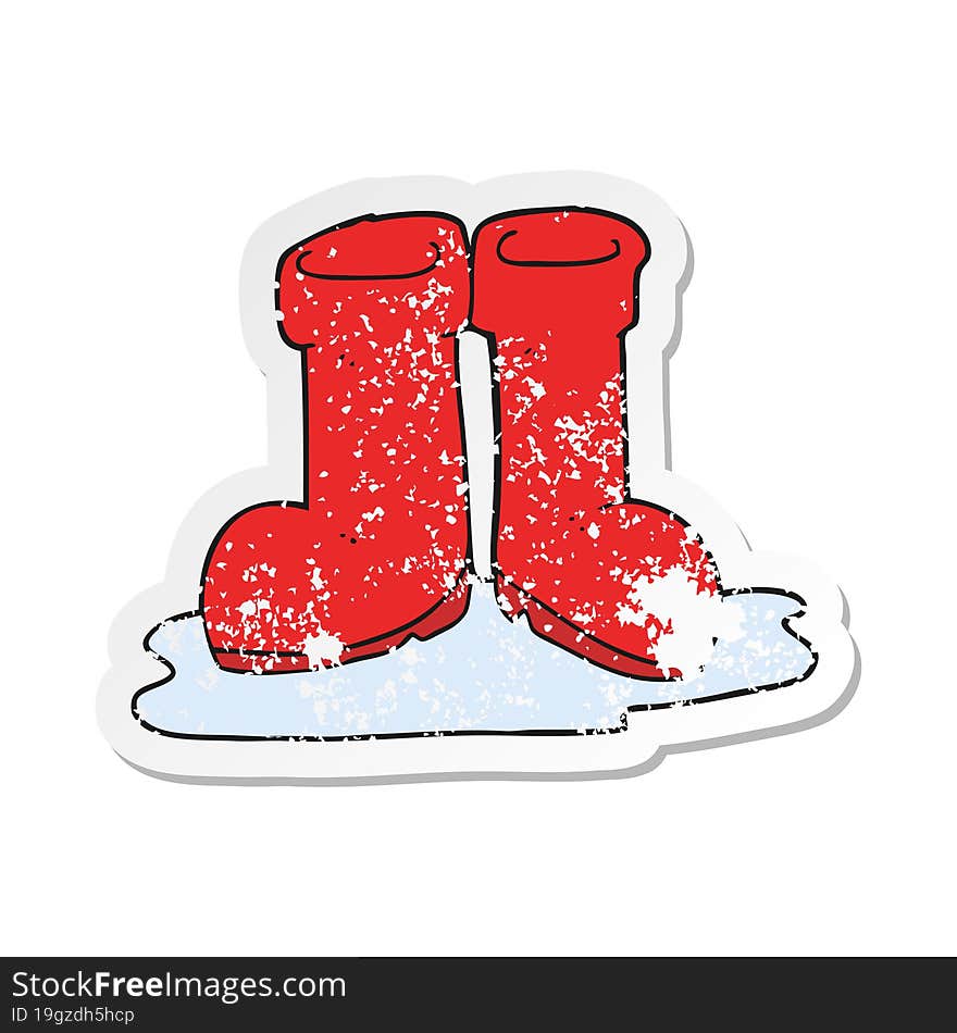 retro distressed sticker of a cartoon wellington boots in puddle