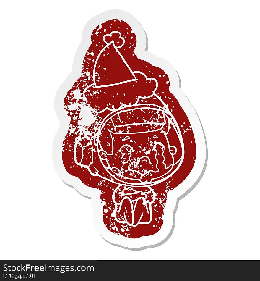 cartoon distressed sticker of a crying astronaut wearing santa hat