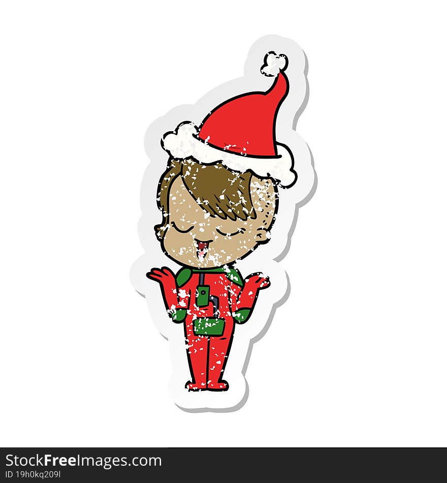 happy distressed sticker cartoon of a girl in space suit wearing santa hat