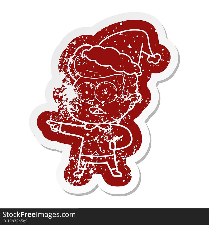 Cartoon Distressed Sticker Of A Staring Man Wearing Santa Hat