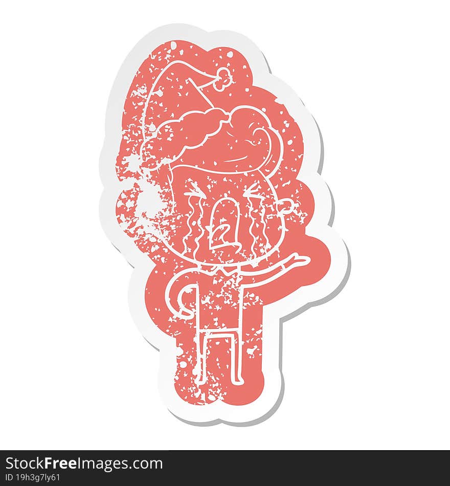 cartoon distressed sticker of a crying man wearing santa hat