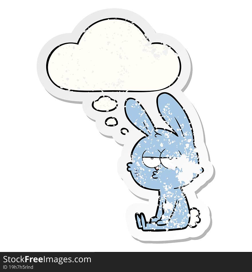 cute cartoon rabbit with thought bubble as a distressed worn sticker