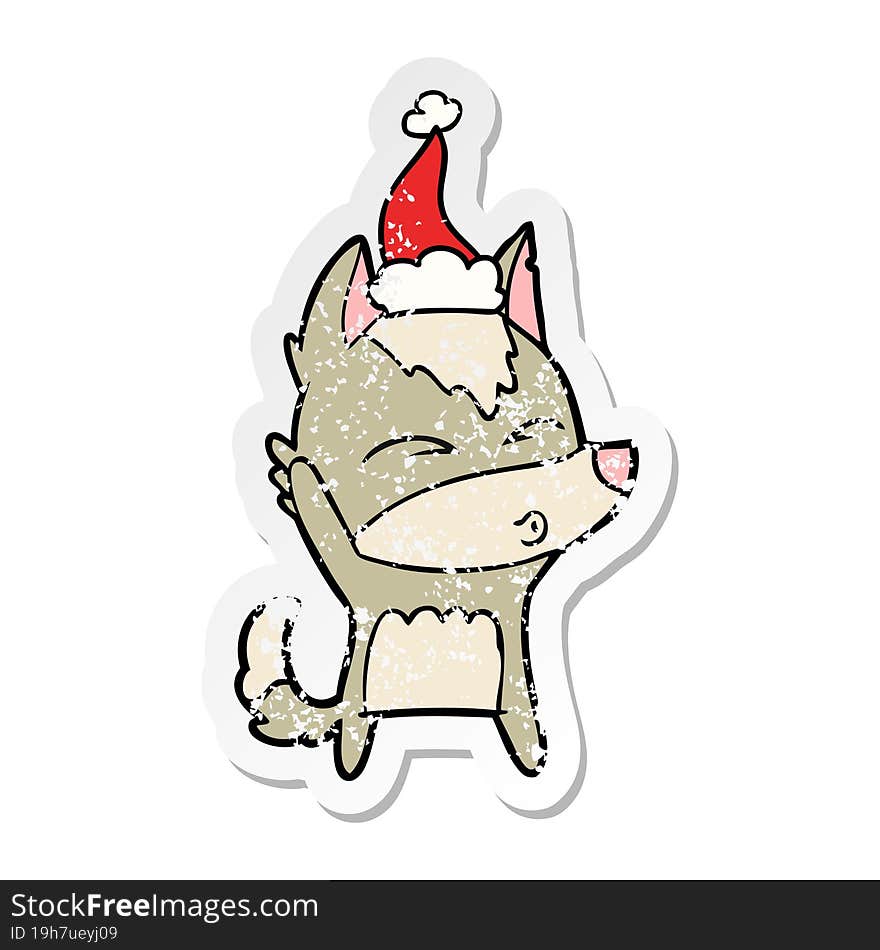 distressed sticker cartoon of a wolf whistling wearing santa hat