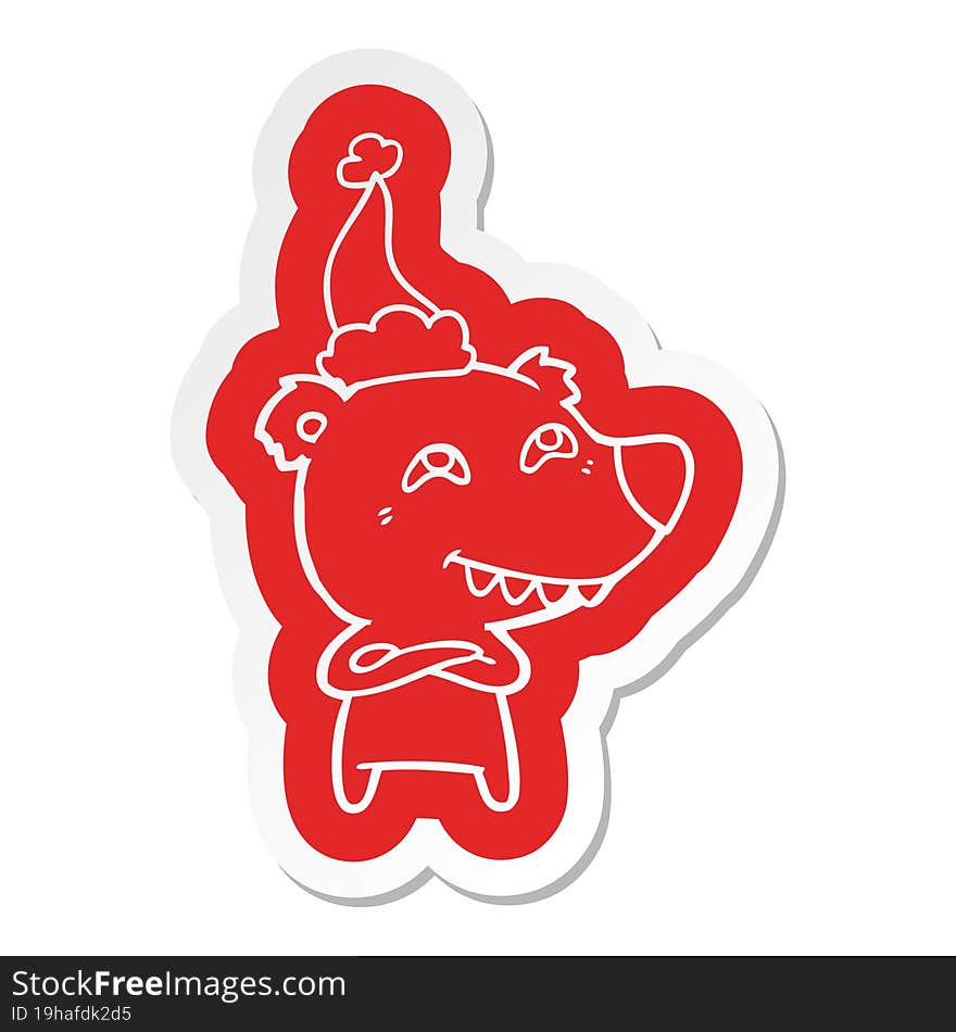 cartoon  sticker of a bear showing teeth wearing santa hat